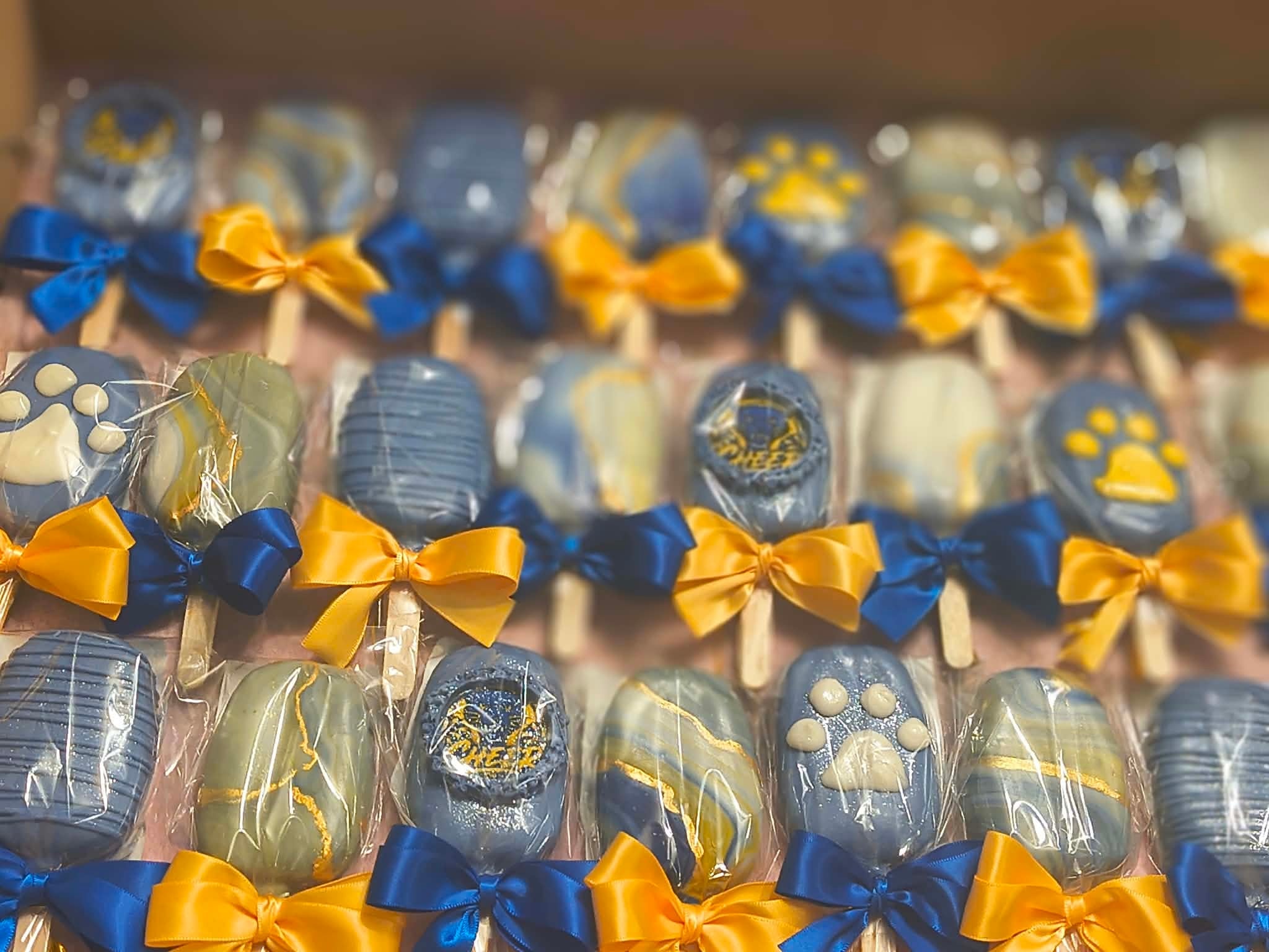 Chocolate dipped treats with decorative bows